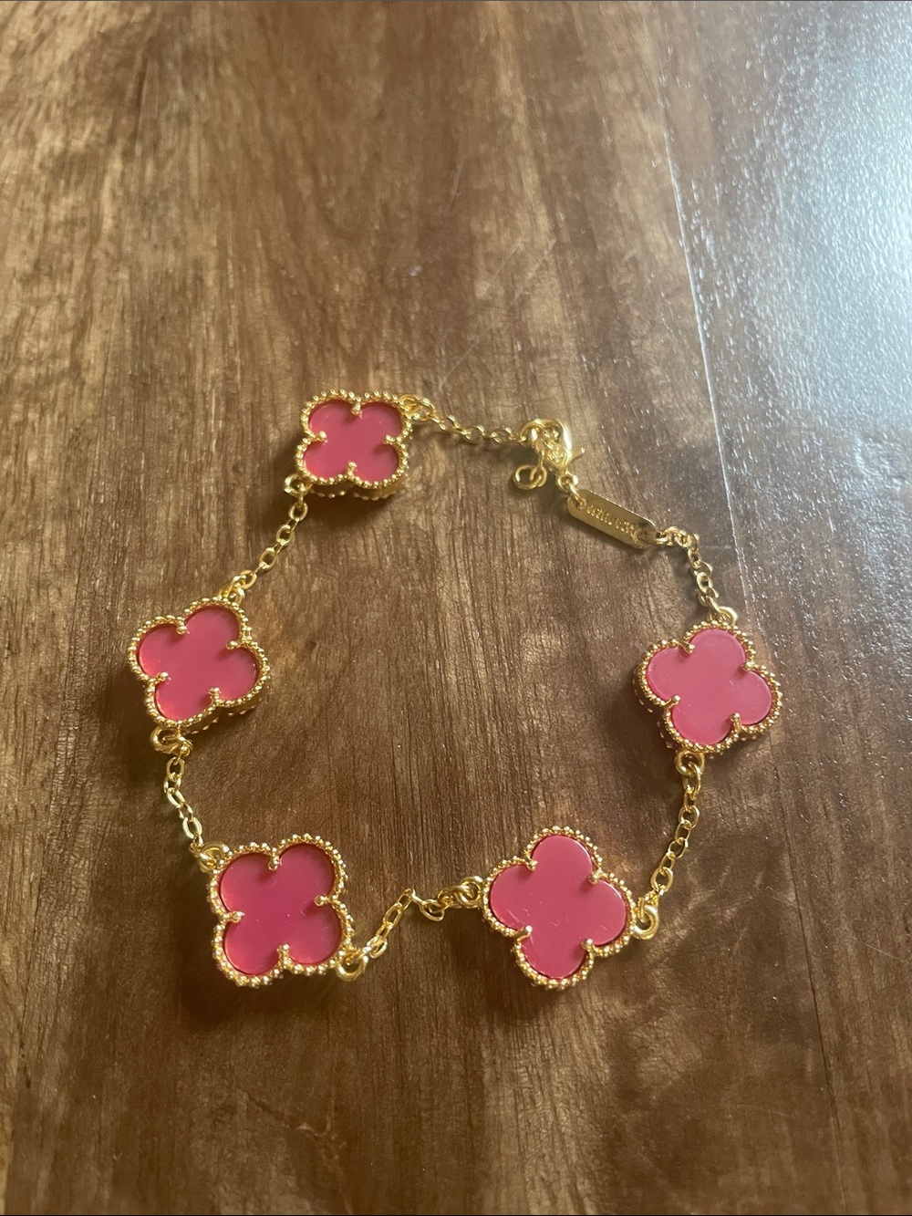 Gold-Tone Bracelet with Red and Pink Clover Accents